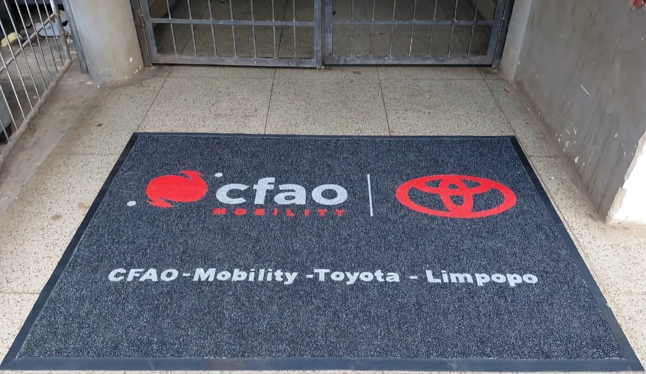 Dealership entrance mat with dealer branding