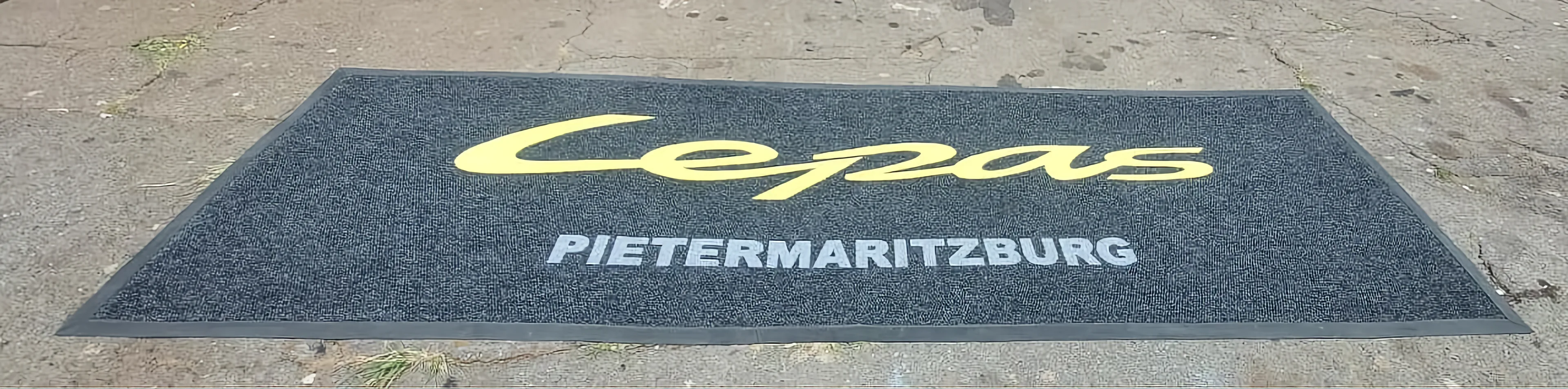 Custom logo entrance mat for a motor dealership showroom