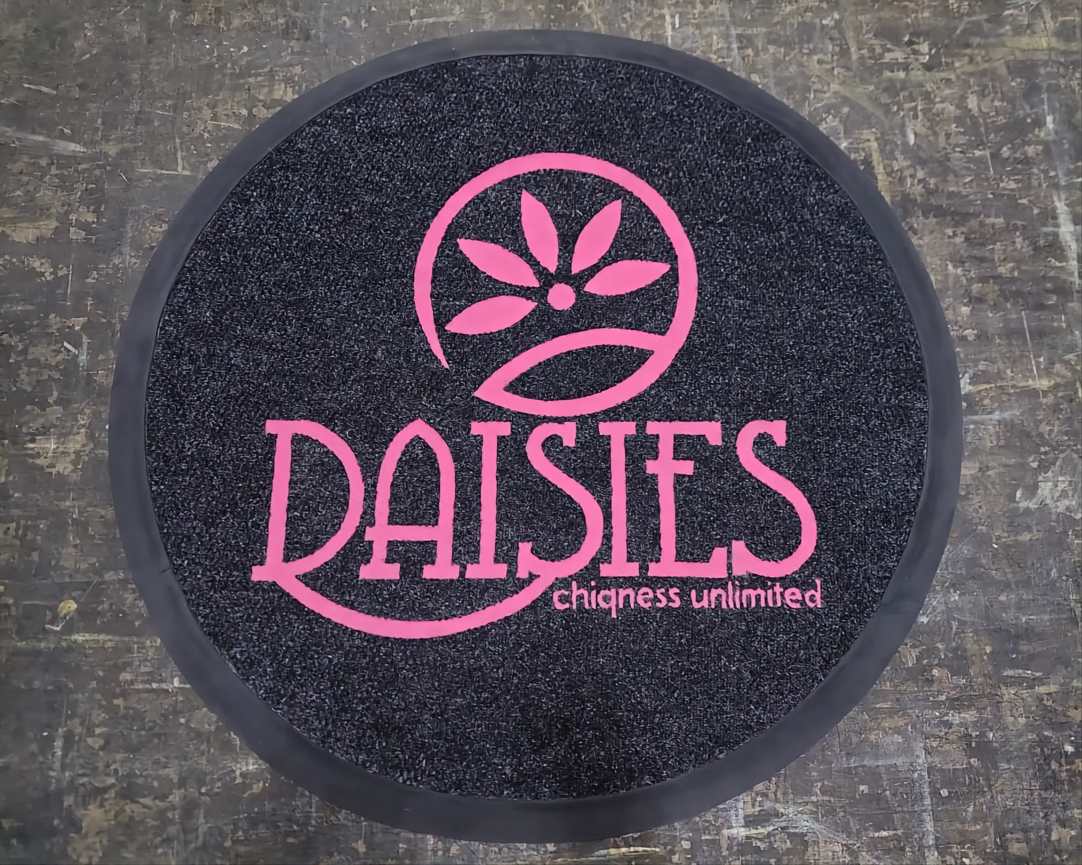Logo door mat for a boutique retail entrance