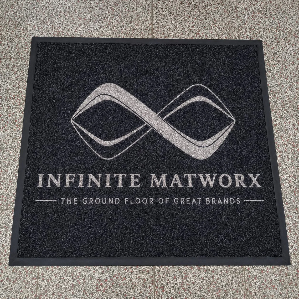 Craftsmanship of a custom branded entrance mat manufactured by Infinite Matworx